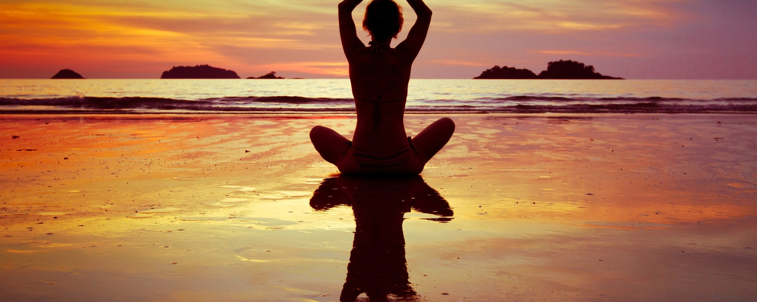 Female yogi in Parivrtta Surya Yantrasana, a complex yoga pose combining balance,