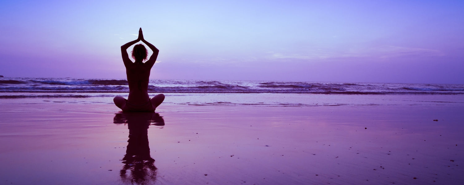 Woman practicing Compass Pose yoga, stretching her legs,twisting her torso.